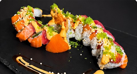 Typhoon Roll topped with tuna, salmon and rice pearls